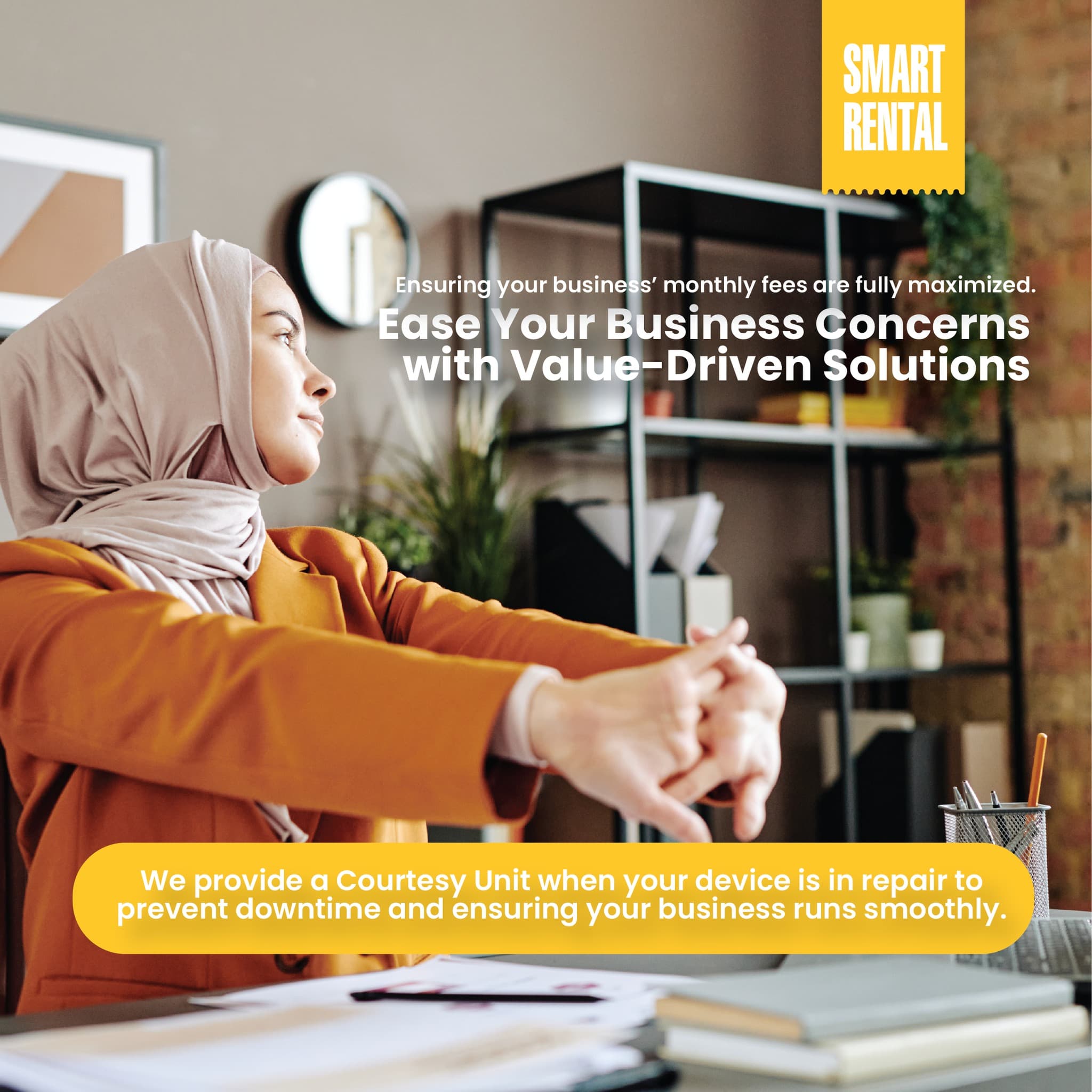 Office workers using their laptops in the office.